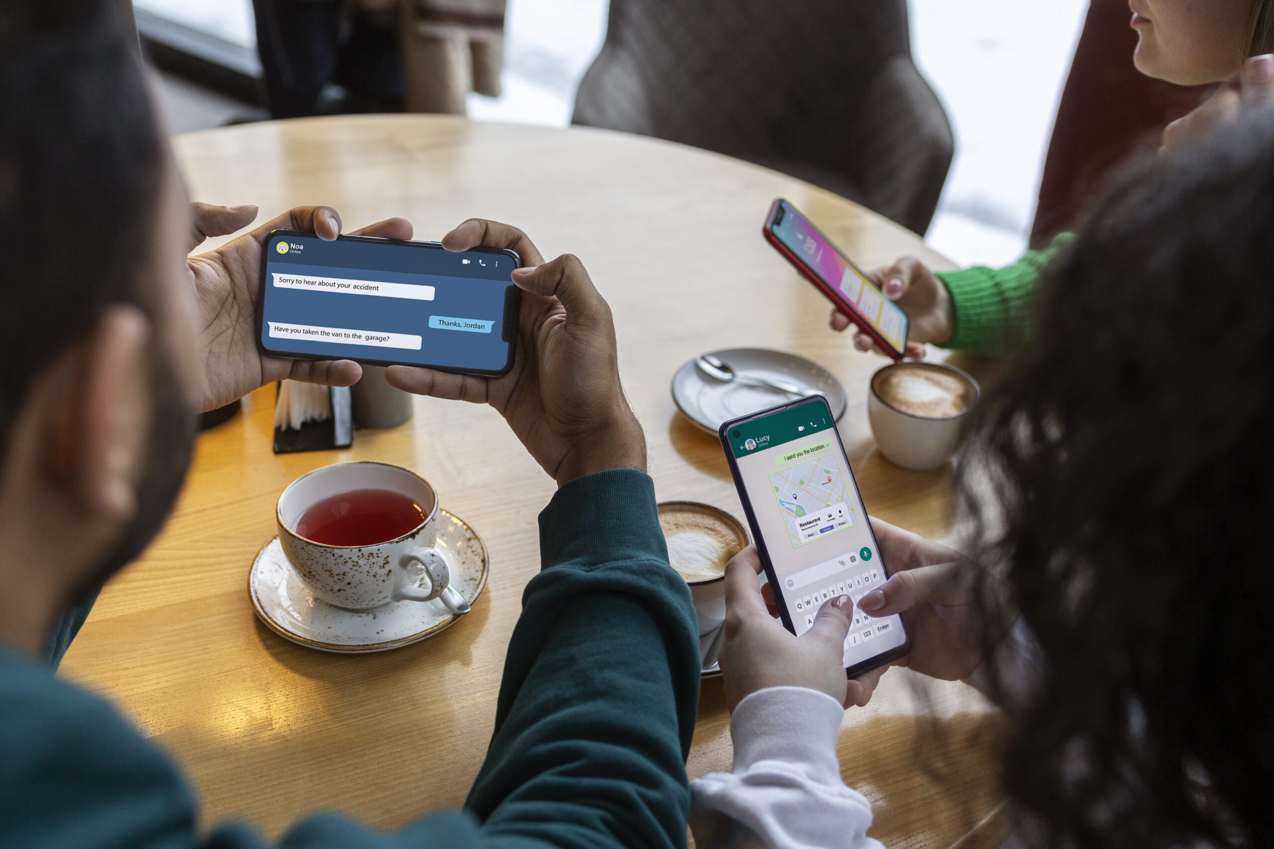 high-angle-friends-holding-smartphones
